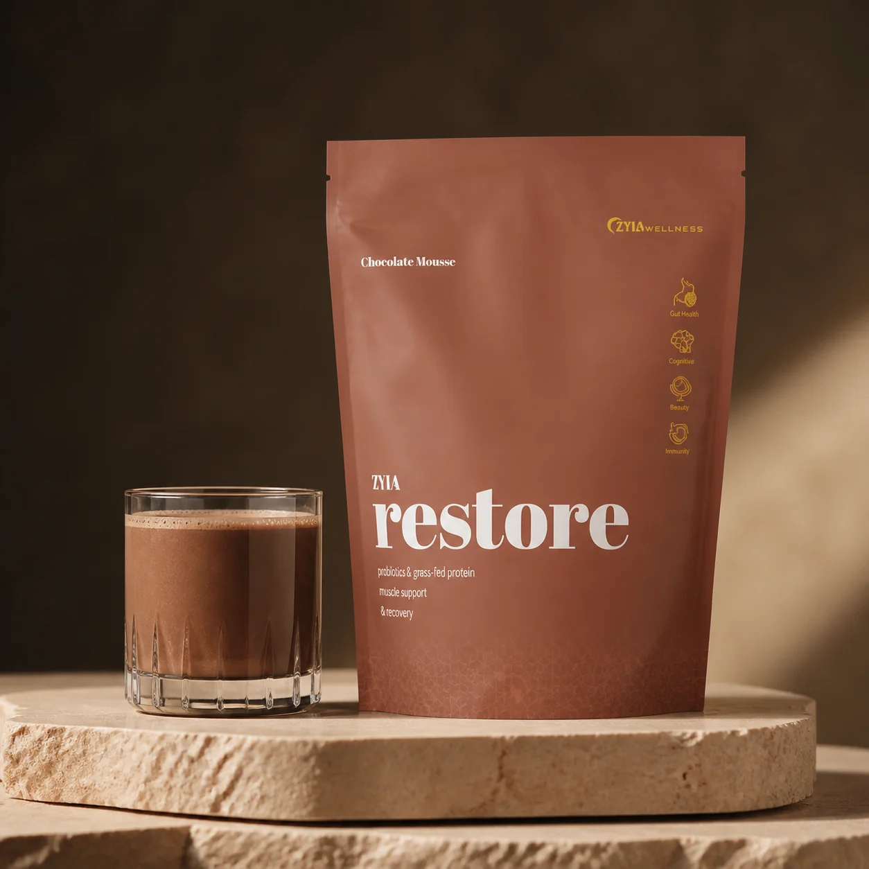 ZYIA Restore pouch beside a prepared chocolate shake